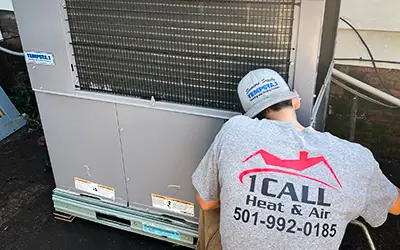 1 Call Heat & Air repairs a customer's air conditioner in Little Rock